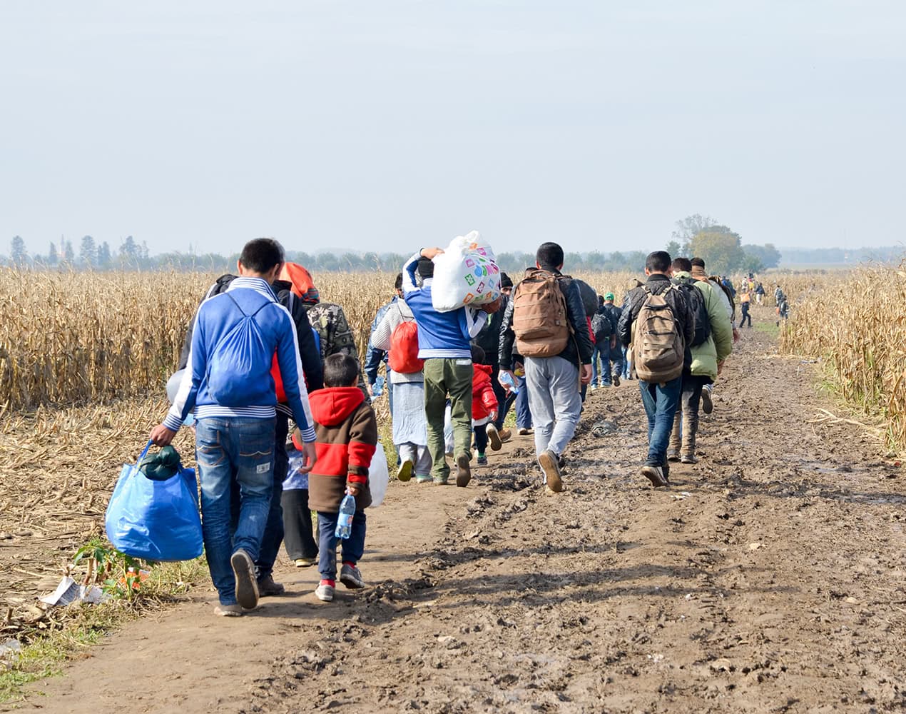 Migrant Workers Walking Rural Road